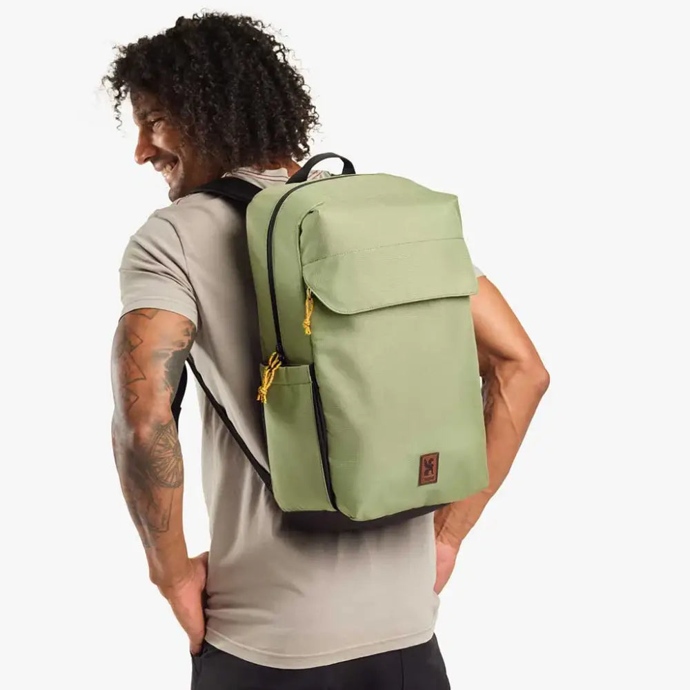 Ruckas Backpack 23L Oil Green. This 23L backpack is all about access. Easily get to your gear through the side or top with it's 3/4 length main zipper. Made from recycled materials. Stow the essentials, and be ready for the day.