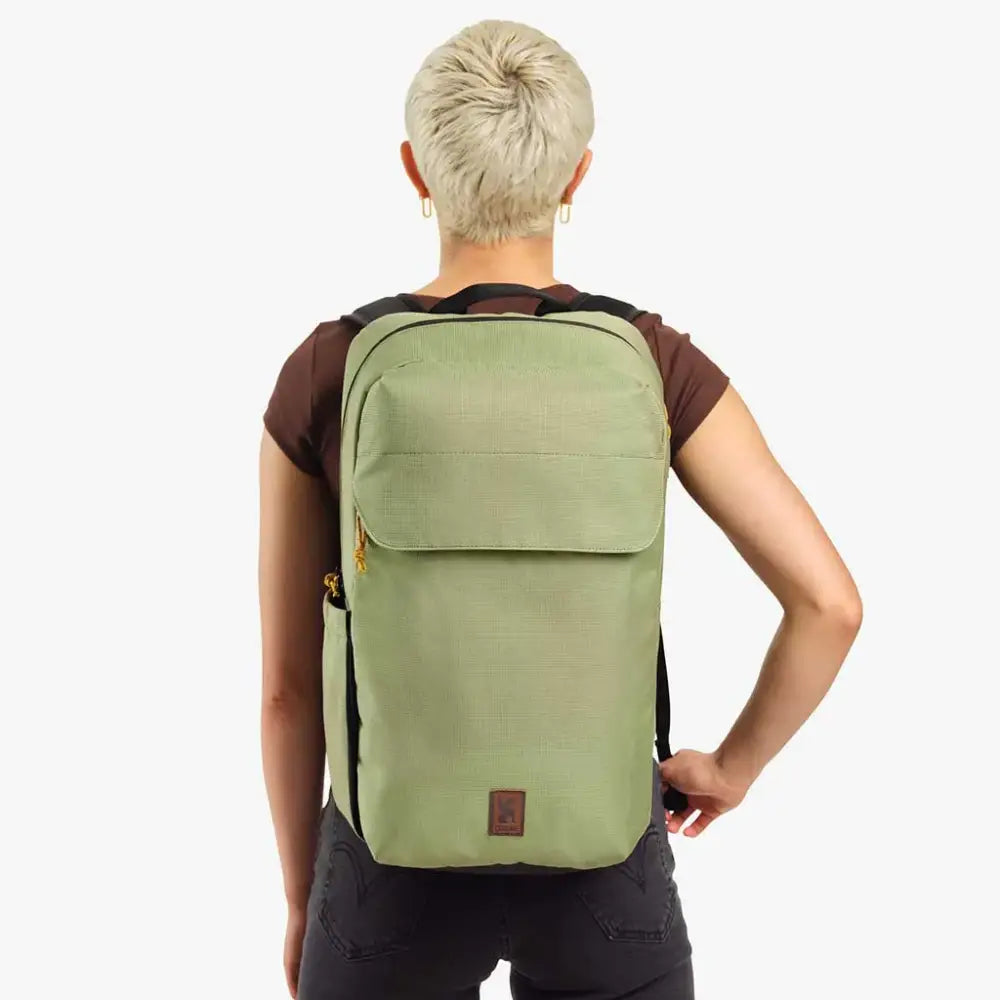 Ruckas Backpack 23L Oil Green. This 23L backpack is all about access. Easily get to your gear through the side or top with it's 3/4 length main zipper. Made from recycled materials. Stow the essentials, and be ready for the day.